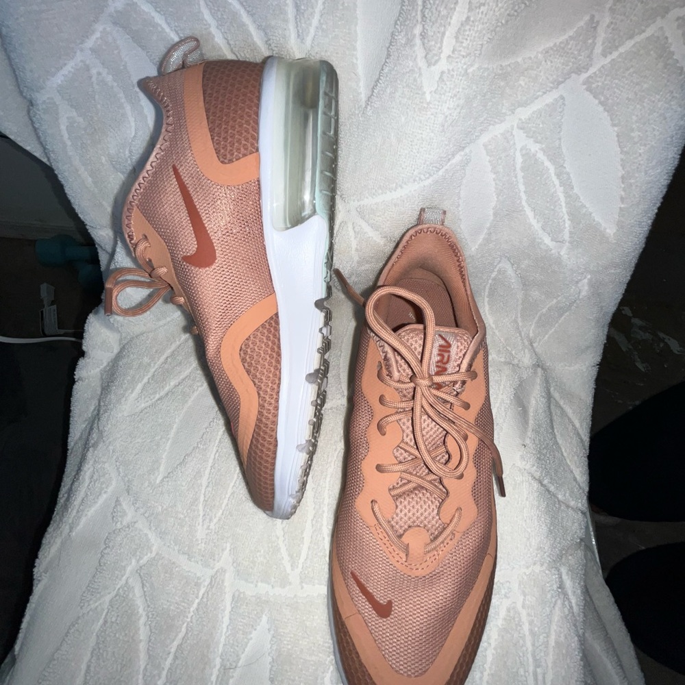 Nike AirMax sneakers. The color is salmon color (not orange) worn 1-2 times.